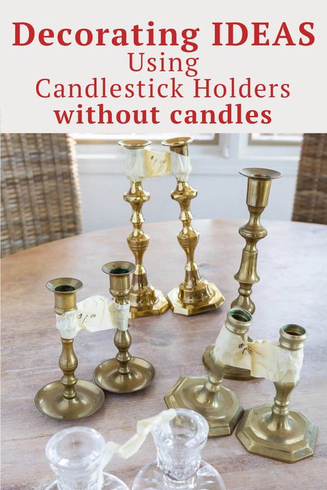 How to use candlesticks without candles when home decorating. Many easy and doable ideas using the candle holders you already own in new and creative ways. Gold Candle Sticks Decor, Decorating With Candelabras, Mix And Match Candle Holders, Styling Brass Candlesticks, Upcycle Candle Stick Holders, What To Do With Candle Holders, Wall Candlestick Holder, Candlestick Topper Ideas, Old Candelabra Ideas