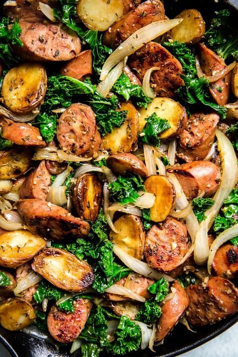 This recipe ticks all the boxes—a little meaty, some dark leafy greens, and some starchy goodness. An easy one-pan sausage, kale and potato skillet that pleases everyone, from cook to clean-up crew. Kielbasa And Kale Recipes, Chicken Kale Sausage Recipes, Kale Potatoes And Sausage, Kale Lunch Recipes, Kale And Peppers Recipe, Recipes Using Kale Dinners, Pork And Kale Recipes, Kale Potato Recipes, Dark Green Vegetables Recipes