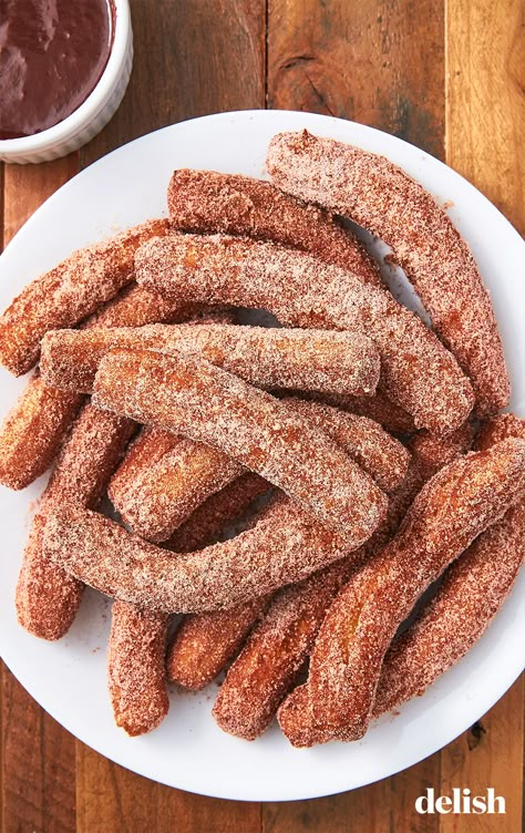 Worth every ounce of effort. Get the recipe from Delish.com. #churros #recipe #homemade #dessert #party #fried #dipping sauce Mexican Christmas Desserts, Easy Churros, Easy Churros Recipe, Homemade Churros, Mexican Desserts, Churros Recipe, Mexican Christmas, Dessert Candles, Disney Recipes