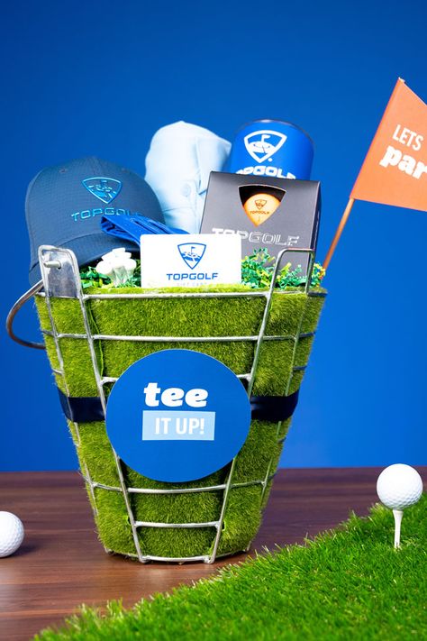 Perfect for the golf lover in your life, whip up a “Tee It Up” Golf Gift Basket with Evite And Topgolf! Golf Themed Basket, Top Golf Gift Basket, Golf Baskets Ideas, Golf Basket Ideas Silent Auction, Golf Theme Gift Basket, Golf Basket Ideas, Golf Easter Basket Ideas, Golf Raffle Basket Ideas, Golf Outing Raffle Basket Ideas