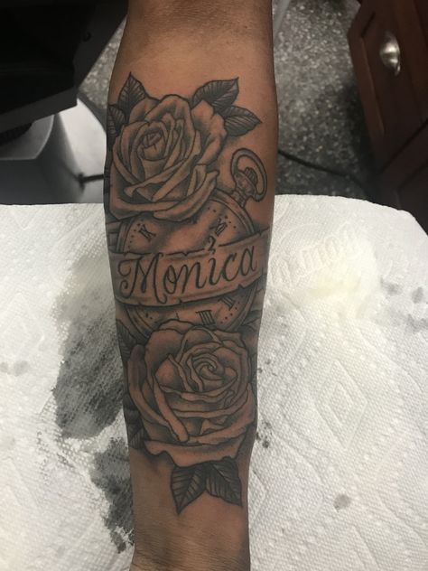 Rose Clock Ribbon Name tattoo for MOM Tattoo With Roses And Name, Name Half Sleeve Tattoo, Name Tattoo With Roses For Men, Name Tattoo With Roses Forearm, Forearm Tattoo Moms Name, Forearm Tattoo With Roses, Mom Name Tattoo Ideas Men, Momma Name Tattoo Ideas, Mom Rose Tattoo For Men