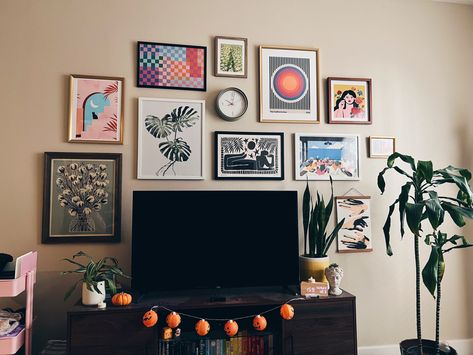 my gallery wall around my tv <3 still decorated partially for halloween lol Photo Collage Around Tv, Gallery Wall Over Tv Stand, Pictures Behind Tv, Gallery Wall Next To Tv, Gallery Wall Over Tv, What To Put Above Tv, Gallery Wall Around Tv Mounted Tv, Living Room Decor Above Tv, Gallery Wall Above Tv