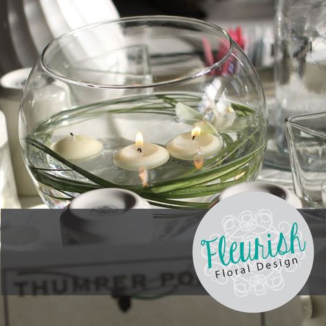 Simple, inexpensive centerpiece by Fleurish Floral Design | Fish Bowl, Bear Grass, Floating Candles Inexpensive Wedding Centerpieces, Fishing Themed Wedding, Cheap Centerpieces, Tables Wedding, Fish Bowls, Fishing Wedding, Wedding Motifs, Cheap Flowers, Fall Wedding Centerpieces