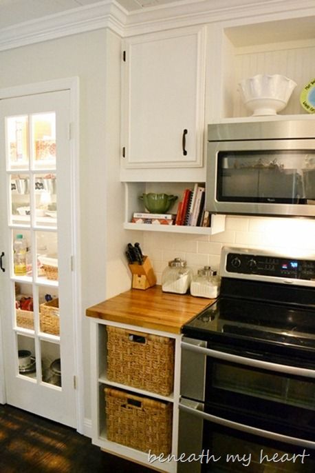 if redoing an older kitchen, move cabinets up to ceiling height, then add under-cabinet storage for cookbooks/spices/etc.  I also love the baskets and butcher-block.  thanks Beneath My Heart Under Cabinet Shelf, Kitchen Cabinets To Ceiling, Cabinets To Ceiling, Under Cabinet Storage, Diy Countertops, Top Decor, Diy Kitchen Cabinets, Diy Cabinets, Old Kitchen