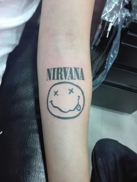 Nirvana 90s Band Tattoos, Nirvana Word Tattoo, Tattoo Ideas Nirvana, Nirvana Nevermind Tattoo, Small Nirvana Tattoo, Tattoos Nirvana, Nirvana Quote Tattoo, Nirvana Symbol, Nirvana Logo Tattoo