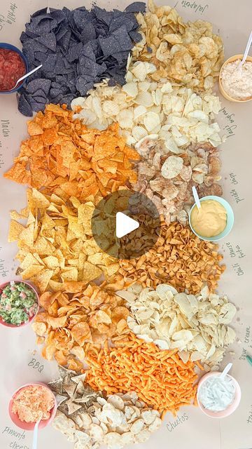 Tina Green | TheBearAndTheFawn on Instagram: "I recently hosted a party at our house that was family friendly so I thought a table with tons of chips  and dips (along with sliders, fruit and hotdogs) would be a fun and easy way for people to graze and I can attest that it was a huge hit!! I call this a CHIPCUTERIE! 🤣💖  You can have people bring dips or store bought is okay too! We had hardly had any leftovers because this was a hotspot 💖    Whah dip would be a must if you did this?!?      #chipcuterie #chipanddip #chipanddipbowls #chips" Chip And Dip Bar, Senior Party, Dip Bar, Chip And Dip, Food And Snacks, April 3, Table Display, Party Fun, Host A Party