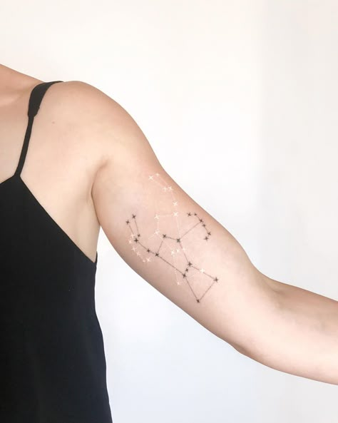 Black and white Orion constellation tattoo by Ann Gilberg inked on the left bicep