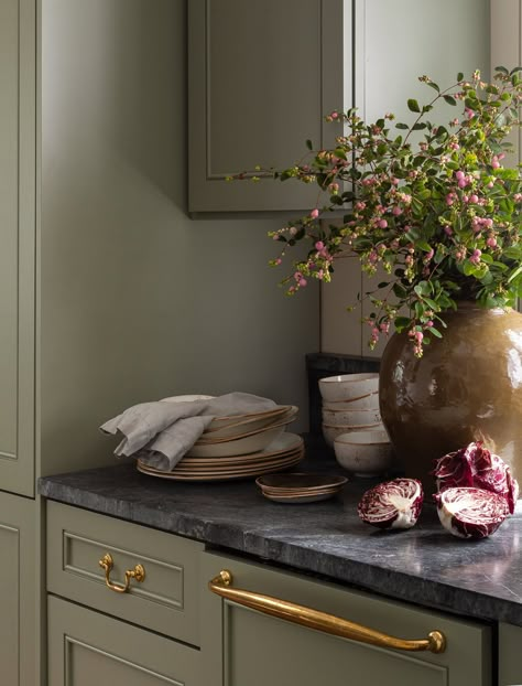 Olive green kitchen cabinetry with black marble countertops and bronze drawer pulls. Green Cottage Kitchen, Shiplap Island, Heidi Caillier, Green Kitchen Cabinets, Seattle Homes, Pattern Tiles, White Shiplap, Interior Vintage, English Cottage Style