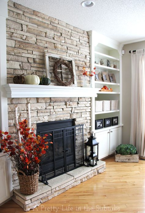 This is a decent representation of what I want our fireplace to look like EXCEPT - the colors (dark grey/black brick, cabinets to match the color in kitchen), and I would want the stone/fireplace to be build OUT a bit more, to make it stand out. Love the mantel over the stone! Salons Cottage, Stone Fireplace Designs, Stacked Stone Fireplaces, Brick Fireplace Makeover, Fireplace Remodel, Home Fireplace, Fireplace Makeover, The Fireplace, Stacked Stone