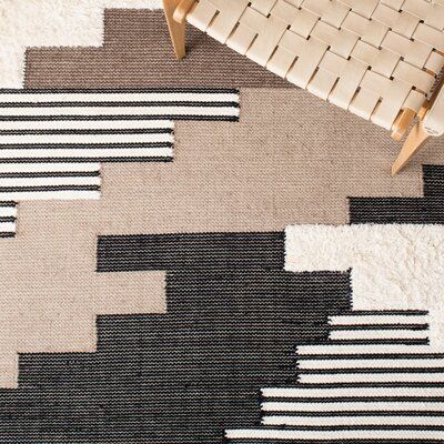 This hand woven area rug warms up your hardwood floors and delivers a rustic air to your living room. It's handmade from wool and cotton, and it pairs a geometric pattern inspired by Southwestern textiles in a palette of black, brown, and ivory hues. We love how the 0.2" pile height means it provides cushion underfoot but is still easy to vacuum. This area rug boasts a high-low pile mix to better define the pattern. Roll it out with a rug pad underneath to keep it securely in place. Loon Peak Ru Southwestern Contemporary Decor, Wool Textures, Woven Area Rug, Lake Havasu, Area Rug Design, Wool Crafts, Ivory Rug, Flat Weave Rug, Boys Bedroom