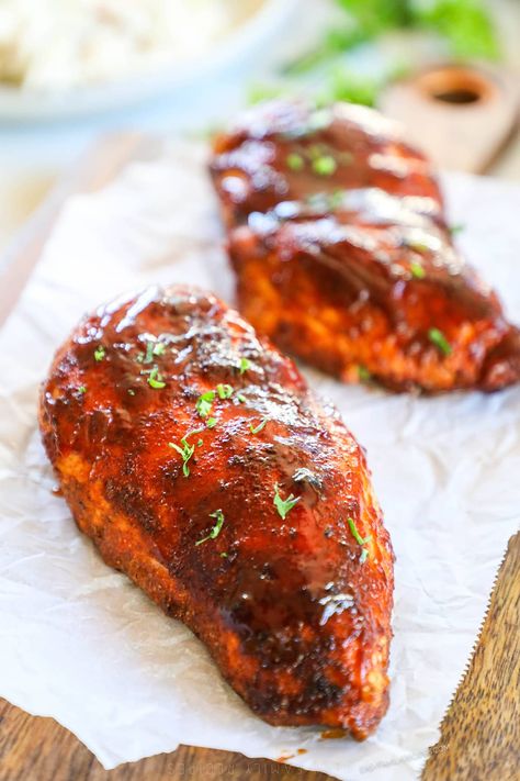 This 30 Minute Baked BBQ Chicken Breast is a summer recipe you can enjoy all year long! The chicken is slathered in a sweet, smoky, savory spice blend, covered in BBQ sauce, then baked until tender and juicy. Serve this Oven-Baked BBQ Chicken with any of your favorite summer side dishes. It's a meal that the whole family will love that takes just 5 minutes to prep. Serve this BBQ Oven Baked Chicken as is or shred it up and use it in another recipe! Oven Baked Bbq Chicken Breast, Oven Bbq Chicken Breast, Baked Bbq Chicken Breast, Easy Baked Bbq Chicken, Bbq Baked Chicken Breast, Chicken Breast Easy, Baked Bbq Chicken Recipes, Bbq Chicken Breast Recipe, Oven Bbq Chicken