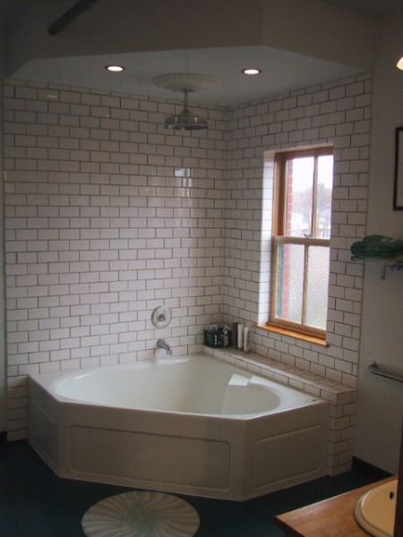 Tile surround, the wall and shelf, maybe wood board around the tub. Bath Tub Shower Combo, Jet Tub Shower Combo, Corner Tub Shower Combo, Corner Bathtub Shower, Corner Tub Shower, Bathtub Shower Combo, Open Showers, Small Tub, Bathtub Remodel