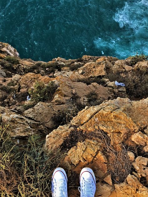 #Travel #Cliff #Sky #Clouds #Nature #Edge #Europe #Trip #Life #Wallpaper #wpp #Joy #iPhone7 #Portugal #Converse #ShotoniPhone Edge Of Cliff Aesthetic, Script Base, Cliff Aesthetic, The Words We Keep, Edge Of Cliff, Two Oceans Meet, Atla Aesthetic, Corpse Flower, Ocean Cliff