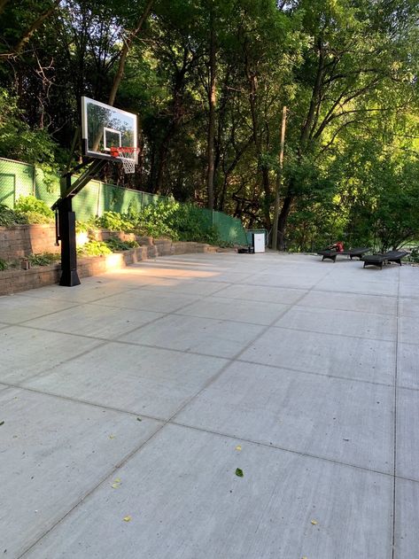 7 Steps to Building Your At Home Basketball Court  #basketballtraining #shootinggun #homecourt #sportcourt Basketball Court With Pavers, Small Home Basketball Court, Patio With Basketball Hoop, Landscaping Around Basketball Court, Grass Basketball Court, Stained Concrete Basketball Court, Patio Basketball Court, How To Paint Basketball Court Lines On Concrete, At Home Basketball Court