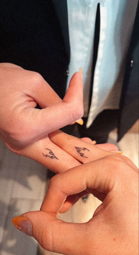 Small flame tattoo on finger Finger Tattoos Sisters, Matching Finger Tats Friends, Finger Tats Matching, Finger Tattoo Matching, Match Finger Tattoo, Small Pair Tattoos, Finger Best Friend Tattoos, Tiny Matching Tattoos Couple Finger, Mini Matching Tattoos Best Friends Finger