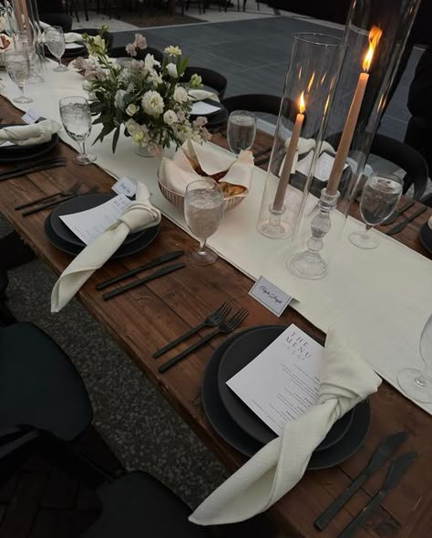 Mumu Weddings shared a post on Instagram: "the tablescapes were definitely some of my favorite details from the wedding—the black table settings and dark wood contrasted with the lush greenery of south carolina was so elegant and timeless. it truly was a stunning black tie affair!". Follow their account to see 4549 posts. Dark Wood Table Setting Ideas, Black Place Mat Table Setting, Black And Wood Dinner Table, Table Runner On Dark Wood Table, Black And Wood Table Setting, Wood And Silver Decor, Black And Wood Party Decor, Dinning Room Dark Wood Table Decor, Black Cheese Cloth Table Runner Wedding