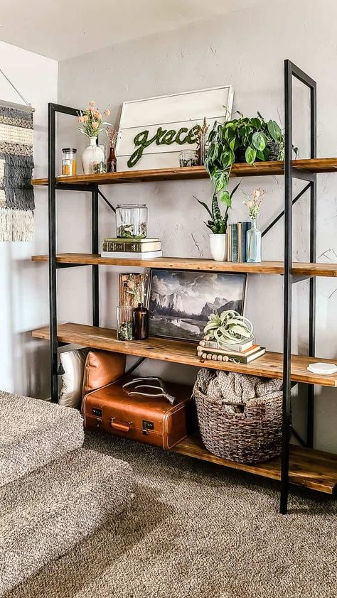 Are you looking for inspiration for your spring living room decor?? See how we styled our shelves with moss vases and vintage books for a boho look. Shelving For Living Room, Dark Wood Shelves Living Room, Living Room Decor Vintage Modern, Display Shelves Living Room, Modern Boho Chic Living Room, Decor On Shelves, Boho Shelf, Spring Room, Shelving Units Living Room