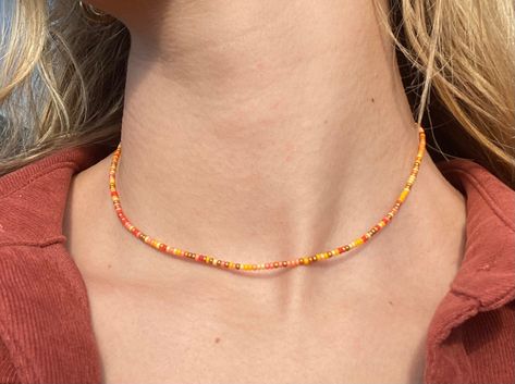 Perfect fall pieceIncludes different shades of yellow and orange creating a nice neutral necklaceGreat for layering Beaded Yellow Necklace, Yellow Necklace Bead, Orange Necklace Beads, Fall Necklaces Diy, Yellow Glass Bead Bracelet, Yellow Seed Bead Necklace, Orange Beads Necklace, Autumn Necklace Fall Jewelry, Orange Beaded Jewelry