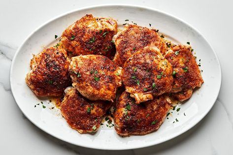 The perfect blend of garlic powder, paprika, onion powder, salt and fresh cracked pepper brightens up plain old chicken thighs and adds wow-worthy flavor to this recipe! Paprika Chicken Thighs, Chicken Thighs In Oven, Oven Baked Chicken Thighs, Crispy Oven Baked Chicken, Crispy Chicken Thighs, Chicken Thigh Recipes Baked, The Modern Proper, Modern Proper, Paprika Chicken