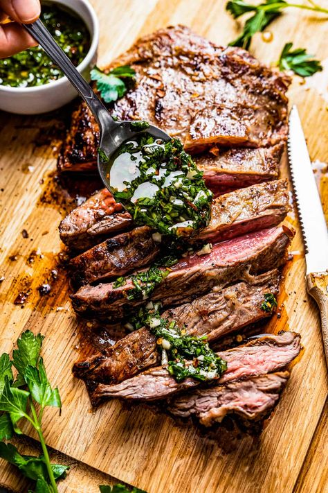 Get ready for an explosion of flavor! This churrasco steak is marinated in a savory-sweet, garlicky sauce, seared to perfection, and served with a bright, spicy chimichurri. Yum! Churrasco Recipe, Churrasco Steak, Flank Steak With Chimichurri, Flank Steak Chimichurri, Steak With Chimichurri, Steak With Chimichurri Sauce, Marinated Flank Steak, Chimichurri Recipe, Grilled Flank Steak