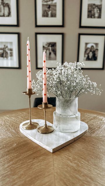 Ashley Alonzo on Instagram: "Simple Valentine dining table decor using a heart serving platter. 💕 Happy Friday Eve Friends! . Heart Candles from: @homegoods . #simpleisbeautiful #simpleisbetter #diningtables" Valentine’s Day Dinning Room Decor, Organic Valentines Decor, Valentine Decor Kitchen, Valentine’s Day Front Entry Table Decor, Dining Room Valentine Decor, Valentines Day Dining Room Table Decor, Coffee Table Valentines Day Decor, Valentine House Decorations, Round Table Valentine Decor