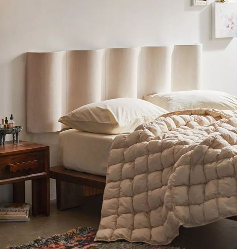 If you're creating a minimalist bedroom, check out these minimalist bed frames to complete your design. Uo Bedroom Inspiration, Modern Industrial Home Decor, Art As Headboard, Round Headboard Bed, Bolster Headboard, Artistic Headboard, Wavy Headboard, Wavy Wood, Tapestry Headboard