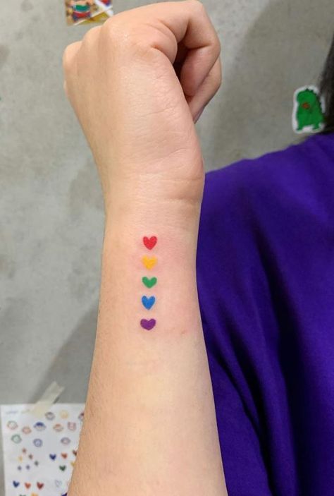 Tiny Colorful Hearts Tattoo - Get an InkGet an Ink Big Red Heart Tattoo, Heart Tattoo Colorful, Rainbow Hearts Tattoo, Colored Hearts Tattoo, Colored Heart Tattoo, Color Heart Tattoo, Tiny Colorful Tattoos, Heart Tattoo Color, Lgbtq Tattoos Ideas