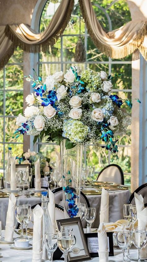 Blue orchids and white rose centerpiece Dendrobium Orchids Centerpiece, White Rose Centerpiece, White Rose Centerpieces, Blue Wedding Centerpieces, Rose Centerpiece, Rose Centerpieces, Dendrobium Orchids, Orchid Wedding, Blue Orchids