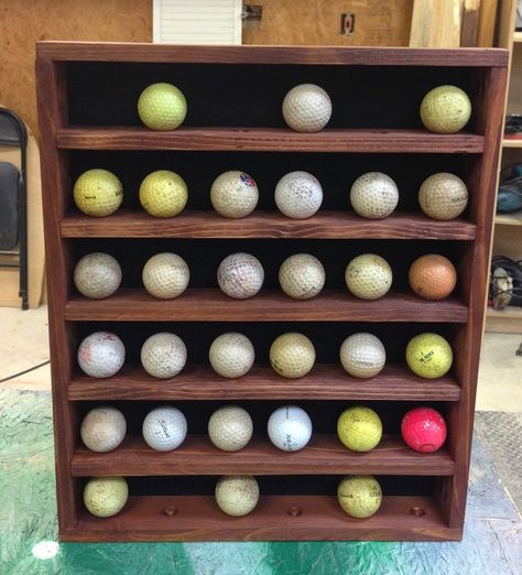 I have been busy making Christmas presents and I wanted to share what I made for my Dad. It didn’t come out as perfect as I was hoping, but I think he will still like it. Excuse the dirty golf balls, they were the only ones I could round up on short notice. As you can see … Golf Display, Diy Display Case, Golf Storage, Golf Ball Display Case, Golf Ball Display, Best Golf Irons, Golf Birthday Gifts, Golf Ball Displays, Golf Ball Holder