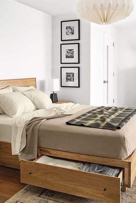 Discover the best storage beds to buy now for an organized and streamlined space. From elevated beds to pull-out drawers, rest easy knowing your items are out of sight. A bed with hidden storage is the perfect solution for small bedrooms and cramped studio apartments.#bedroomdecorideas #homedecorideas #cozybedding #marthastewart Modern Storage Beds, Best Storage Beds, Beautiful Bed Designs, Bed Bases, Small Bedroom Storage, Bed Frame Design, Bed Design Modern, Bed Storage Drawers, Bedroom Bed Design