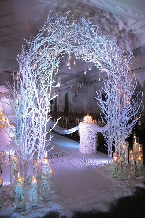 This unique design is stylish and perfect for the winter wedding. The wooden sticks painted white and candles in the jars with hanging bulbs on the arch.#Wedding Walkway Ideas indoor,#Wedding Walkway Ideas pathways,#Wedding Walkway Ideas outdoors,#Wedding Walkway Ideas entrance Winter Wedding Decorations Diy, Winter Wonderland Wedding Decorations, Wonderland Wedding Decorations, Diy Winter Wedding, Wonderland Wedding Theme, Wonderland Party Decorations, Rustic Wedding Decorations, Winter Wonderland Decorations, Winter Wonderland Theme