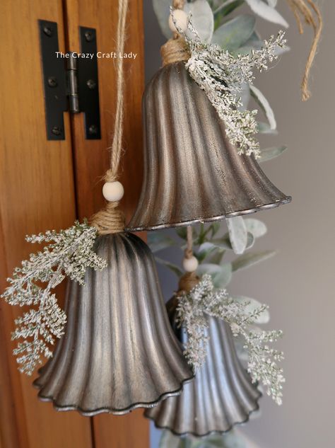 Make this DIY silver bell trio and transform plastic bells from the dollar store into high-end holiday decor Bundt Pan Christmas Crafts, Diy Jingle Bell Garland, Vintage Christmas Store Displays, Rustic Christmas Bells Diy, Diy Bejeweled Christmas Ornaments, Diy Giant Jingle Bells, Silver Bells Christmas Party Theme, Large Bells Christmas Decor, Hobby Lobby Diy Ornaments