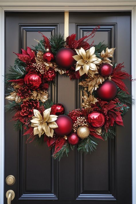 Festive holiday wreath with red and gold ornaments hanging on a black door. How To Make Holiday Wreaths, Christmas Ornament Wreath Ideas, Easy Christmas Home Decor, How To Decorate A Large Christmas Wreath, Christmas Wreaths Diy Ribbon, Reef Ideas Christmas, Red And Green Wreath, Christmas Wreath Making Ideas, Christmas Door Wrap