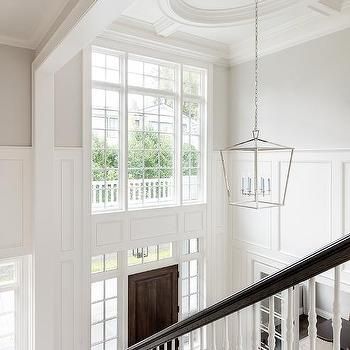 Two Story Foyer Design Ideas Dark Stained Wood Floors, Foyer Paint Colors, White Marble Tile Floor, Trendy Paint Colors, White Staircase, Timeless Interior Design, 2 Story Foyer, White Marble Tiles, Two Story Foyer