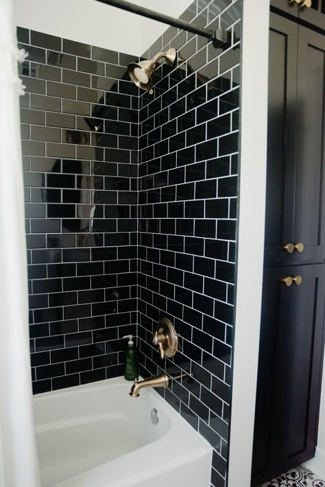 Black Shower Tile With Tub, Black Subway Tile Shower Bathroom, Black Vertical Subway Tile Bathroom, Black Bathtub Shower Combo, Black Subway Tile Bathroom Wall, Black Tile Shower Tub Combo, Bathroom Black Tile Wall, White Tub Black Tile, Black Tile White Tub