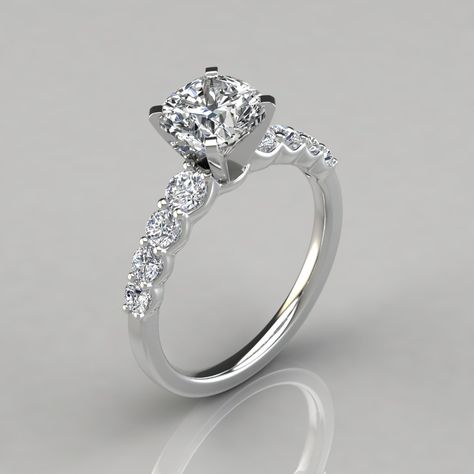 This Magnificent Graduated Cushion Cut Engagement Ring is made to order in Platinum, 14K or 18K White, Yellow or Rose Solid Gold.  It can be customized to your exact specifications to accommodate a center stone from 1.0 to 3.0 carats and It comes as pictured with an additional 8 Round Brilliant cut side stones, in total carat weight of 0.51 Ct.  Please select your choice of Precious Metal and Center Stone Size from the drop-down menus above.  Regarded as the Premier Simulated Diamonds in the wor Wedding Rings Cushion Cut, Wedding Rings Cushion, Radiant Rings, Amazing Wedding Rings, Cushion Cut Moissanite Engagement Ring, Moissanite Engagement Ring Cushion Cut, Wedding Ring Cushion, Engagement Rings Princess, Cute Engagement Rings