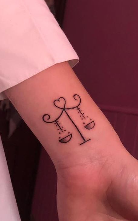 Libra Stomach Tattoo, Tattoo Ideas Female Libra Sign, Zodiac Tattoos Libra Ideas, Cute Libra Tattoos For Women, Libra Wrist Tattoos For Women, Libra Scale Tattoo Simple, Unique Libra Tattoo Ideas For Women, Libra Hand Tattoos For Women, Libra Tattoo Aesthetic