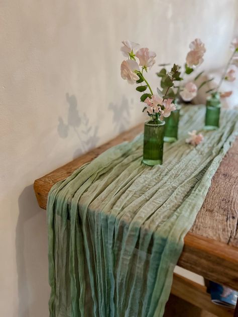 Our brand new coloured table runners are available in 4 different colours.  Which is your favourite? We love them all!! We have dusky pink, duksy blue, sage green and neutral champagne. These cheesecloth table runners can be used on your guest tables or to enhance side tables at your venue. Place over wooden entrance t