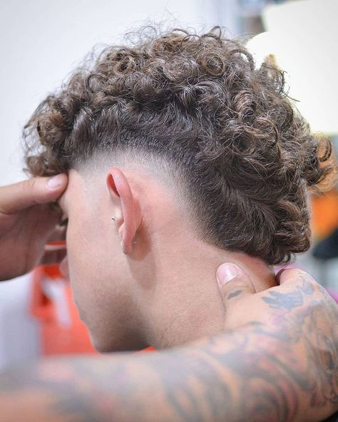 Faded Mullet Men Curly, Burst Fade With Curly Hair, Fohawk Haircut Fade Curly, Mullet Fade Haircut Curly, Mohawk Curly Hair Men, Curly Burst Fade Mullet, Burst Fade Haircut Curly, Curly Mohawk Men, Frohawk Fade Men