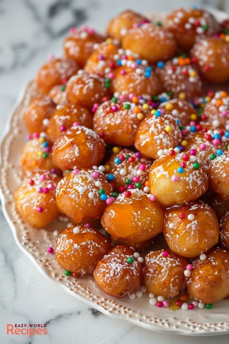 Classic Struffoli is a traditional Christmas dessert from Italy. These light and airy fried dough balls are coated in sweet honey syrup and sprinkles. Italian Struffoli, Honey Balls Recipe, Italian Honey Balls, Pain Au Chocolat Recipe, Fried Dough Balls, Struffoli Recipe, Honey Balls, Italian Christmas Desserts, Authentic Italian Desserts