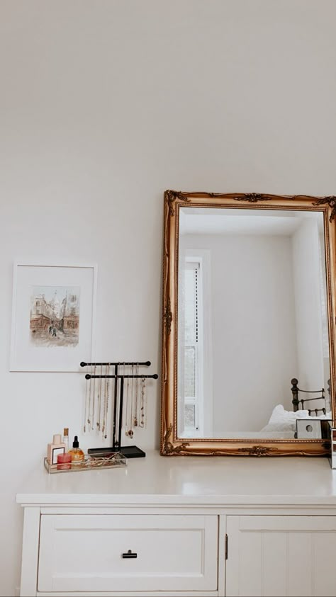 Bedroom Dresser Vanity, Gold Mirror On Dresser, Jewelry On Dresser Top, Feminine Dresser Decor, Mirror On Dresser Leaning, Gold Mirror Above Dresser, White With Gold Accents Bedroom, Jewelry Display On Dresser, Gold Accent Bedroom Ideas