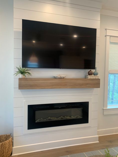 Shiplap coastal design fireplace oak mantle electric fireplace tv focal point luxury design 30A Coastal Fireplace Wall, Modern Coastal Fireplace, Mantle Electric Fireplace, Coastal Fireplace Ideas, Beach Fireplace, Fireplace Options, Fireplace Wall Ideas, Coastal Fireplace, Oak Mantle