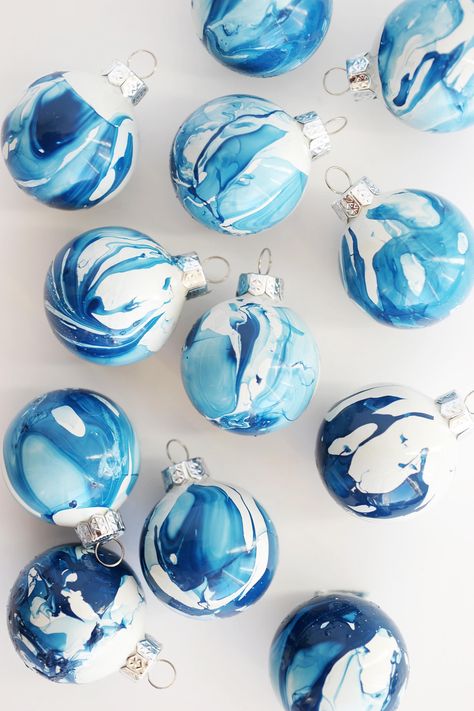 Visit The Sweetest Occasion for dozens of beautiful homemade ornaments including easy DIY ornaments made with simple glass ornaments. Marbled Ornaments, Homemade Ornaments, Navidad Diy, Easy Christmas Diy, Noel Christmas, Blue Christmas, Holiday Diy, Xmas Ornaments, Xmas Crafts