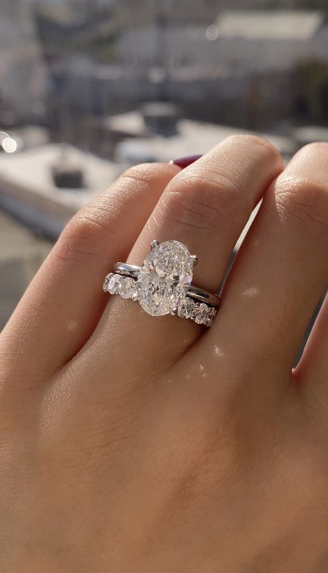 Dream Rings Wedding, Wedding Ring And Band Set, Iconic Wedding Rings, Oval Engagement Ring With White Gold Band, Big Oval Engagement Ring With Wedding Band, Weddinh Rings, Silver Engagement Rings Stack, White Gold Oval Engagement Ring Set, Circular Diamond Engagement Ring