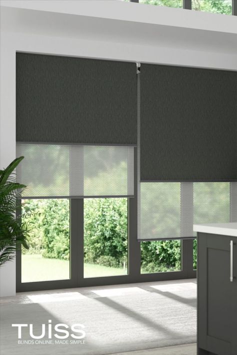 Image shows large windows covered with double roller blinds. The double roller blinds feature two fabric layers. One is a blockout for complete light control and privacy, ideal for nighttime - this shows the blockout roller in a charcoal. The second layer is a sunscreen fabric which is sheer, to cut the glare of the sun during the day and provide daytime privacy, without losing daylight or a view to the outdoors. Modern Blinds Living Rooms, Roller Shades Living Room, Modern Window Blind, Large Windows Living Room, Curtains Design Ideas, Window Blinds Bedroom, Blinds For Large Windows, Roller Blinds Living Room, Roller Blinds Bedroom