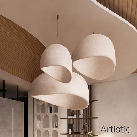 This elegant and modern lighting design features a cluster of three sculptural pendant lights, gracefully suspended from the ceiling. Their organic, asymmetrical shapes create a sense of fluidity and movement, blending seamlessly with the contemporary interior. The warm, neutral tones of the lampshades complement the natural wooden elements of the ceiling and wall panels, creating a harmonious and inviting atmosphere. The backdrop showcases open shelving with curated decor pieces, adding a to... Asymmetrical Shapes, Curated Decor, Modern Lighting Design, Stylish Interior, Decor Pieces, The Ceiling, Organic Modern, Organic Shapes, Wall Panels