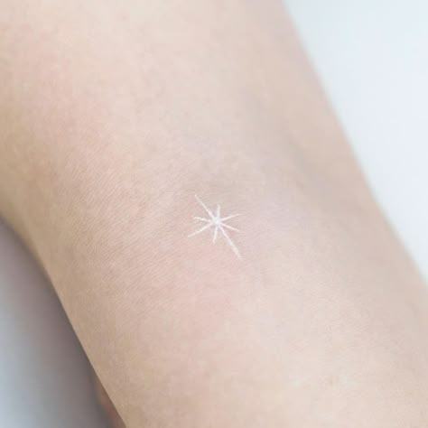 White Tattoo Fine Line, White Star Tattoos For Women, Cute Small Tattoo Ideas For Females, White Light Tattoo, White Minimal Tattoo, White Ink Micro Tattoo, White Ink Minimalist Tattoo, North Star Tattoo White Ink, White Sparkle Tattoo