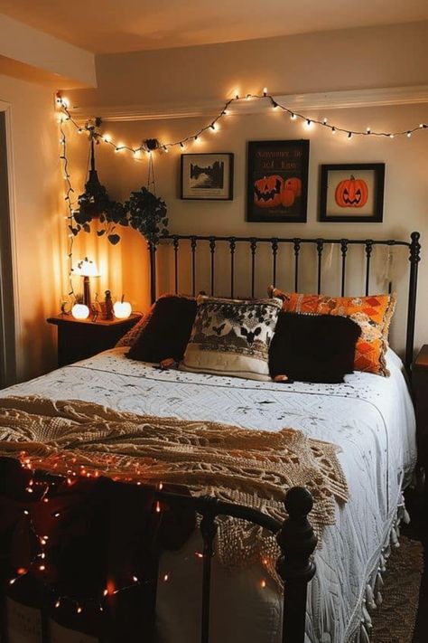 Cozy bedroom decorated with string lights and Halloween-themed decor. Loft Conversion Ideas Layout, Cozy Halloween Bedroom, Spooky Bedroom Decor, Halloween Home Decor Indoor, Halloween Bedroom Ideas, Halloween Themed Bedroom, Spooky Bedroom, Diy Halloween Home Decor, Halloween Bedroom Decor