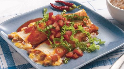 Ham filling replaces more traditional meat selections in these enchiladas that are well paired with sour cream and cheese. Ham Enchiladas, Dinner Schedule, Easy Cheese Enchiladas, Creamy Chicken Enchiladas Recipe, National Taco Day, Easy Beef Enchiladas, Taco Day, Morning Recipes, Creamy Chicken Enchiladas