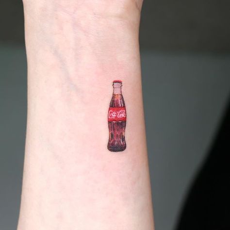 STUDIOBYSOL_Pu-reum no Instagram: “Mini coke 🥤” Coca Cola Tattoo, Cola Tattoo, Tattooing Tips, Tattoo Oil, Tattoo After Care, Cream Tattoo, Tattoo Machine Tattoo, Food Tattoos, Disney Princess Tattoo